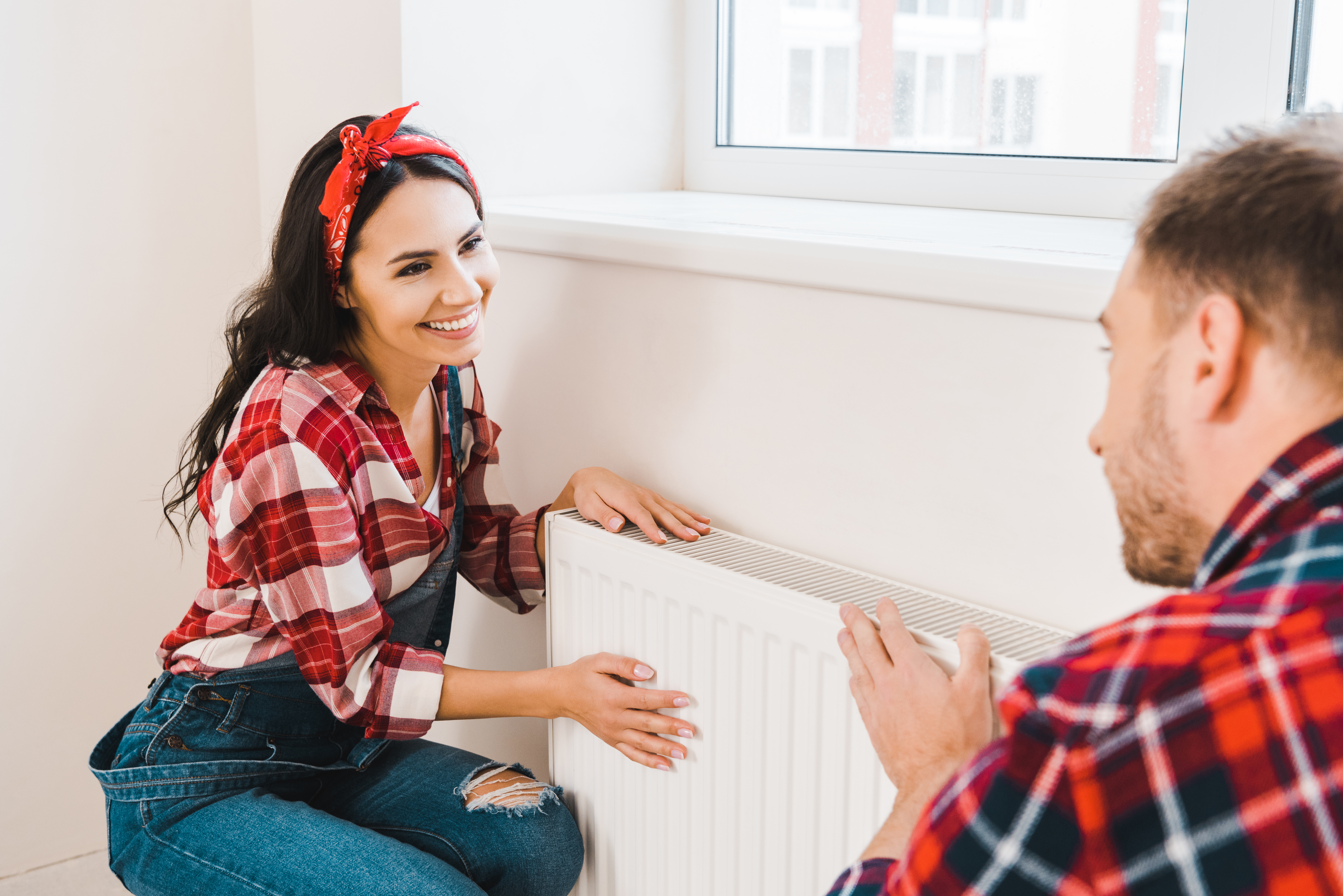 /media/darhrfql/smiling-couple-adjusting-a-radiator-in-a-home-2026-01-06-00-40-01-utc.jpg