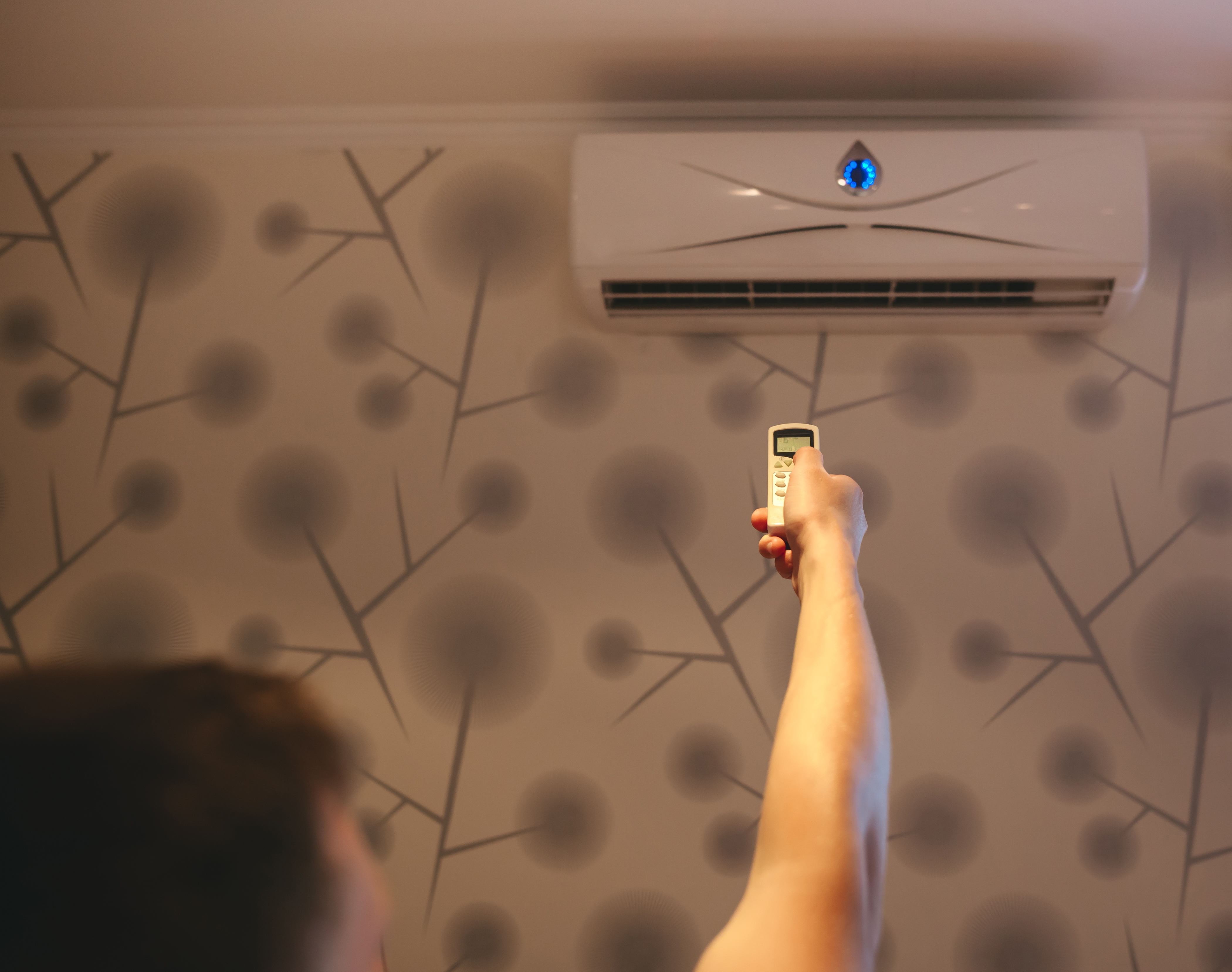 /media/eqof3lil/person-adjusting-air-conditioner-with-remote-contr-2026-03-09-06-36-04-utc.jpg