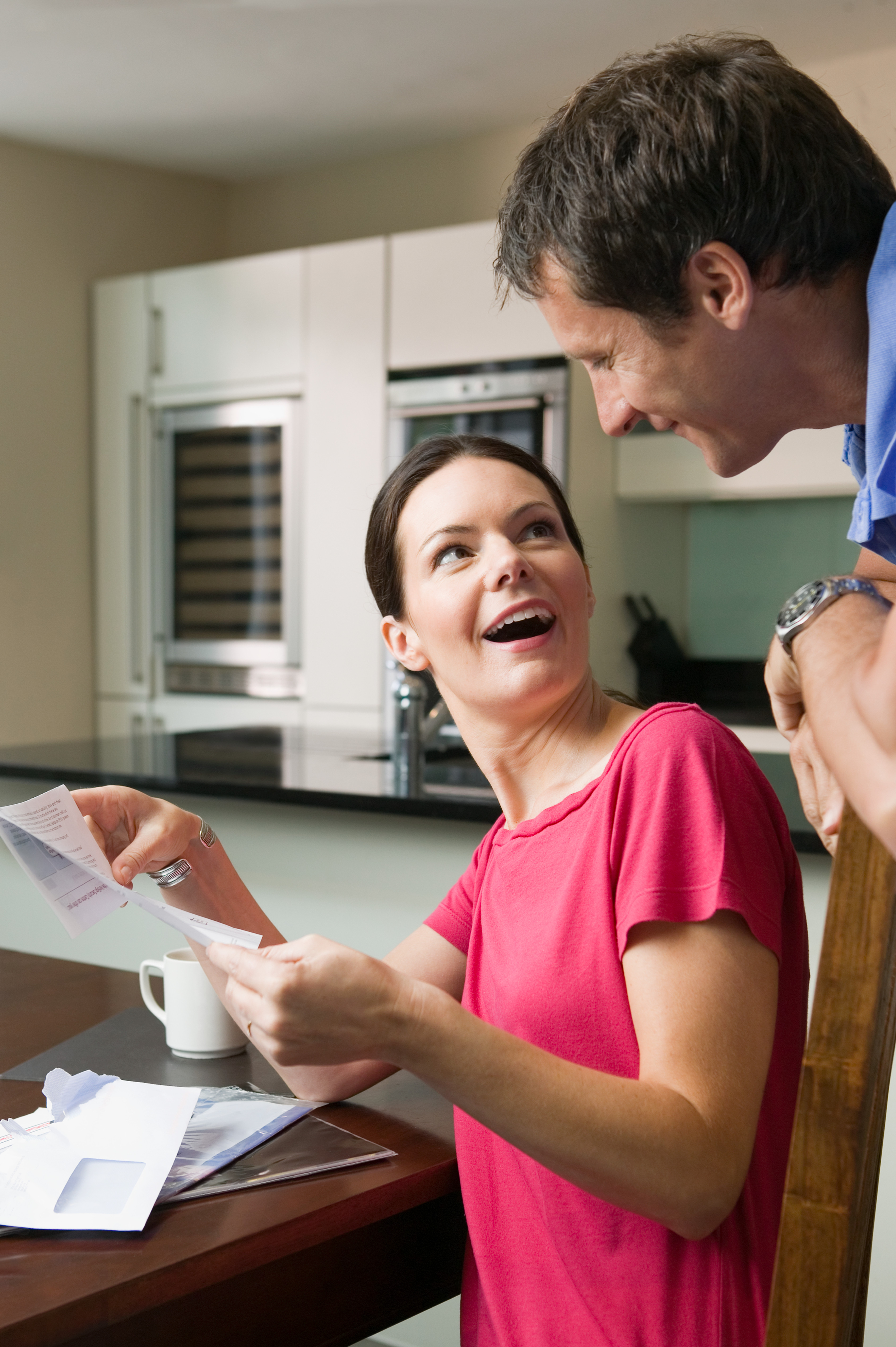 /media/jecjlusx/couple-smiling-at-bills-in-kitchen-setting-2026-01-05-23-31-51-utc.jpg