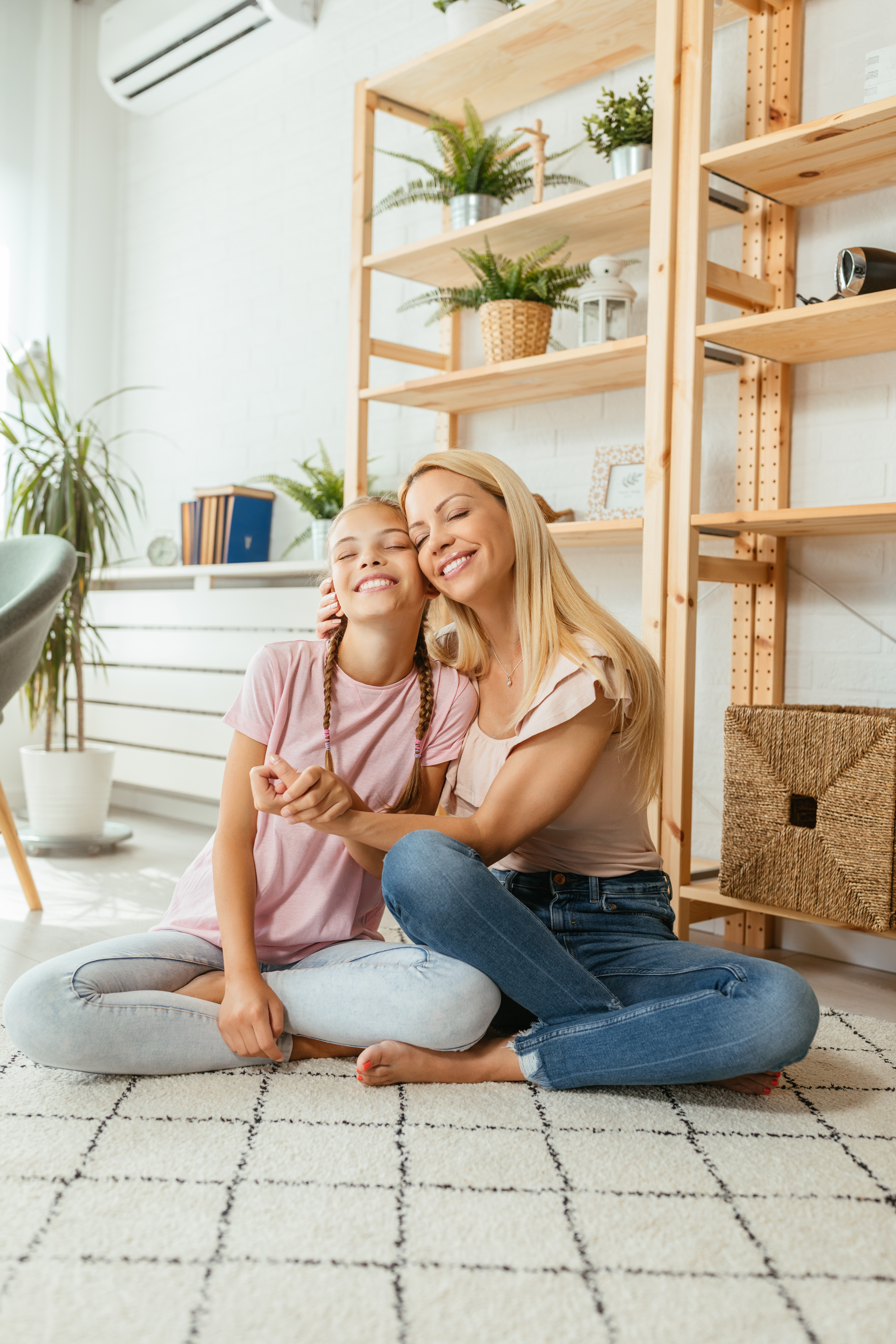 /media/kyllmbtd/smiling-woman-and-girl-embrace-while-sitting-2026-03-09-23-56-12-utc.jpg