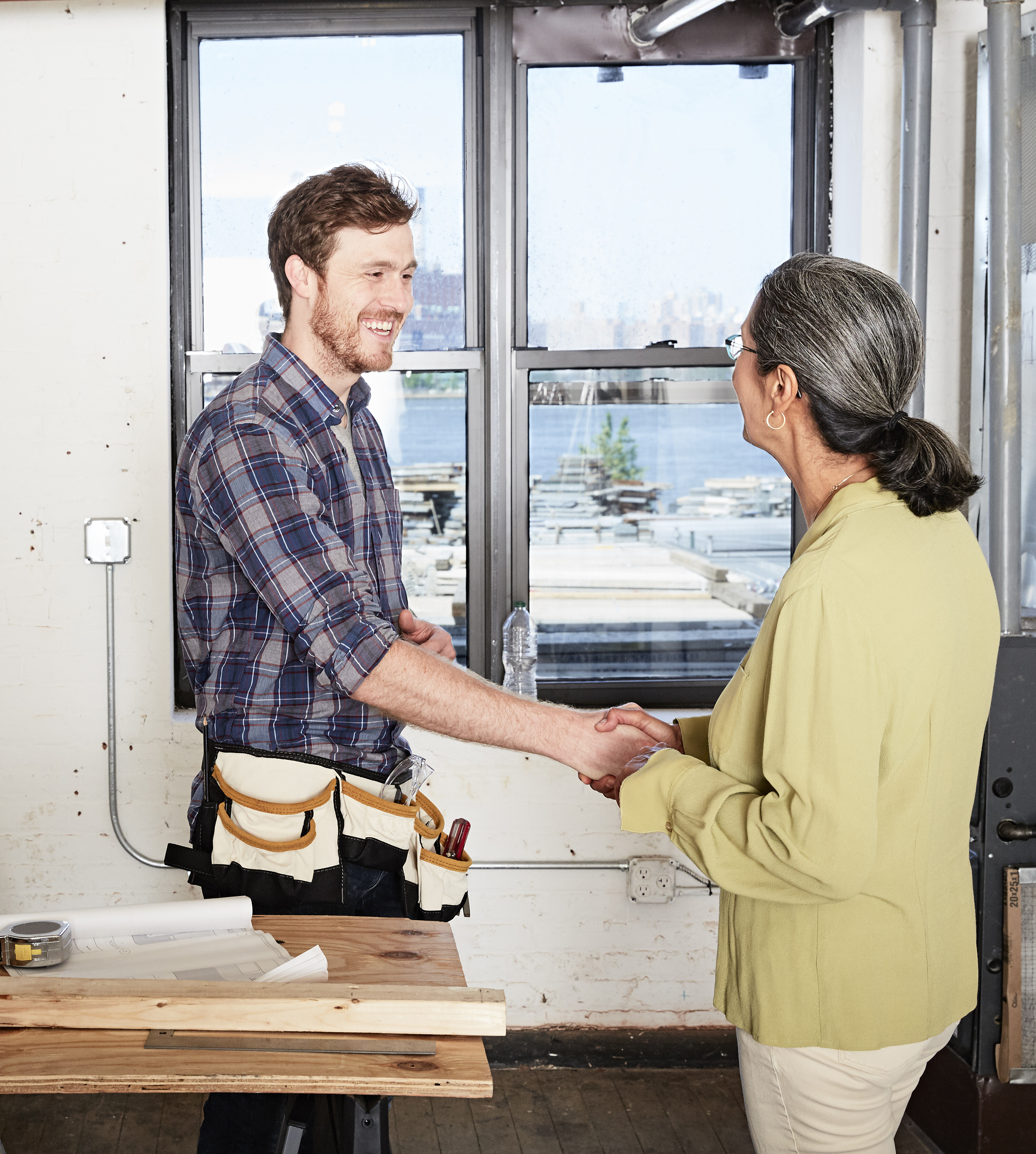 /media/z53l3fds/carpenter-and-client-shaking-hands-near-windows-2026-01-09-08-40-41-utc.jpg